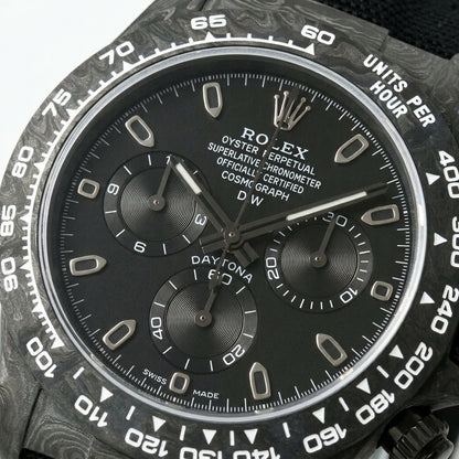 Macro of the matte black dial and its three turntable-brushed black counters