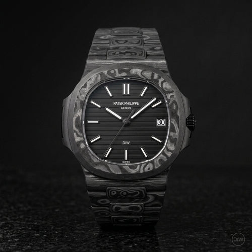 All black carbon sports watch on black granite
