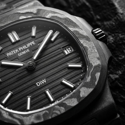 Macro of the ribbed black dial and the marbled carbon bezel