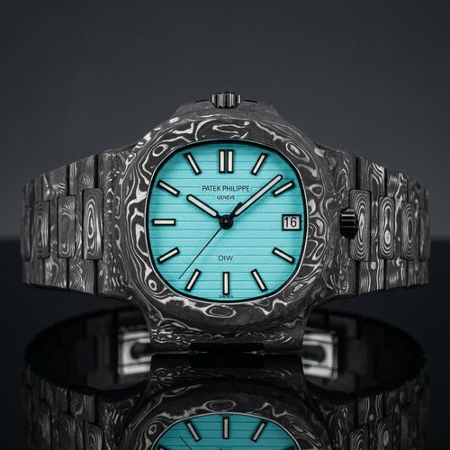 Carbon sports watch with a turquoise dial on black granite