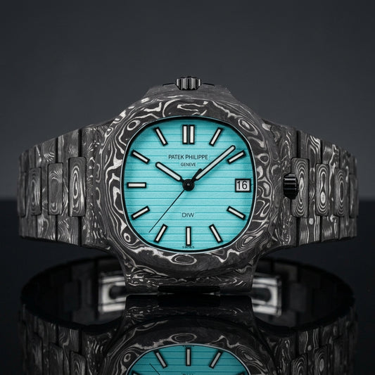 Carbon sports watch with a turquoise dial on black granite