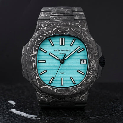 Carbon sports watch and carbon bracelet upright on black granite