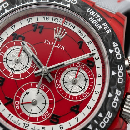 Macro of the red dial inside the white telemetre ring, its three silver counters ringed in red