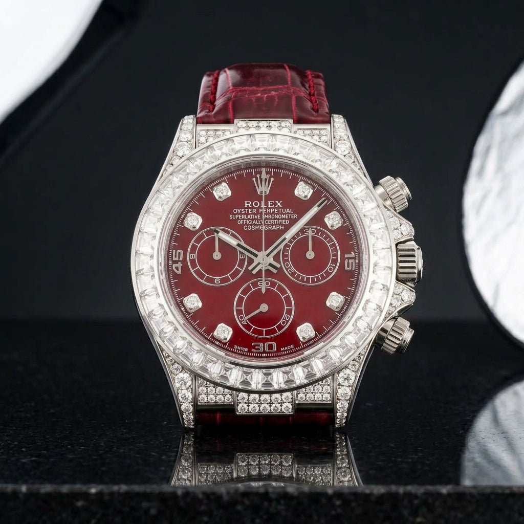 White gold chronograph and bracelet upright on polished black granite