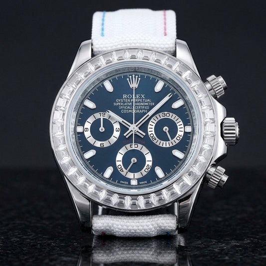 Steel chronograph with a deep blue dial and a bezel of clear baguette-cut stones, upright on polished black granite