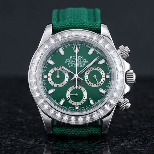 Steel chronograph with a deep green dial and a bezel of clear baguette-cut stones, upright on polished black granite