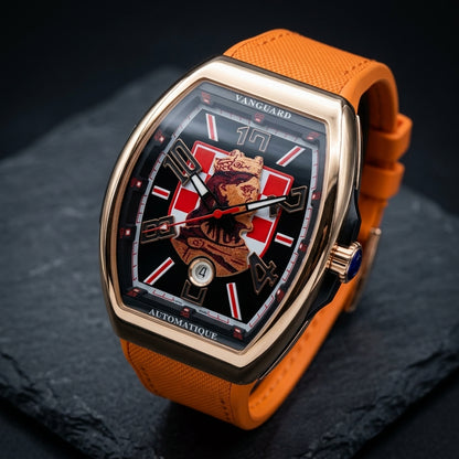Rose gold curved tonneau watch at a three-quarter angle, the black band round its side and the fluted crown with a blue end
