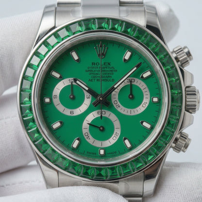 Macro of the green dial, silver counters and square-cut green stone bezel