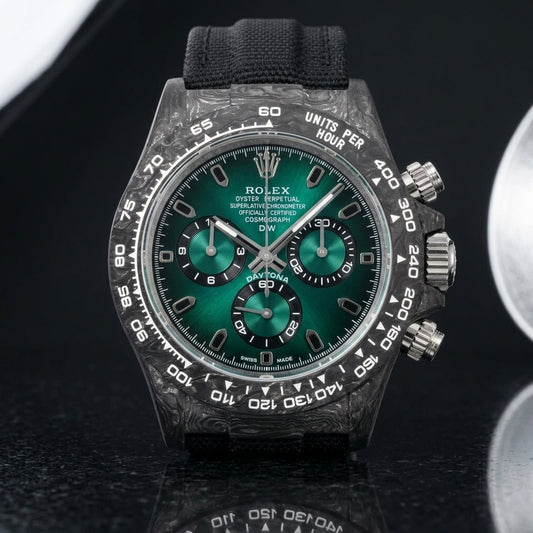 Forged-carbon chronograph with a green sun-brushed dial on pale stone