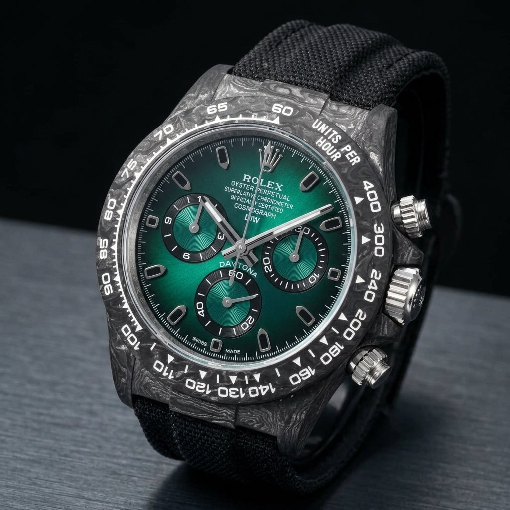 Forged-carbon chronograph at a three-quarter angle on dark slate, black strap