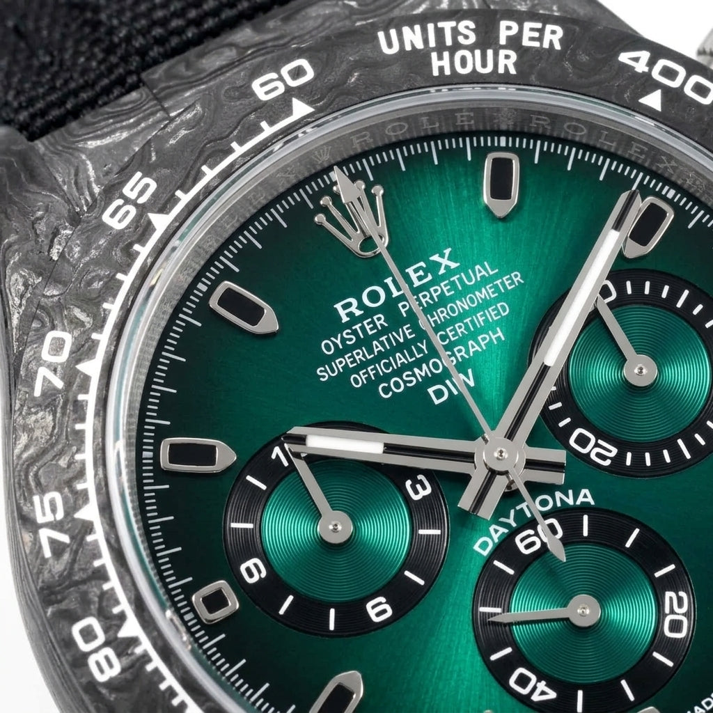 Macro of the green sun-brushed dial and its three green counters in black rings