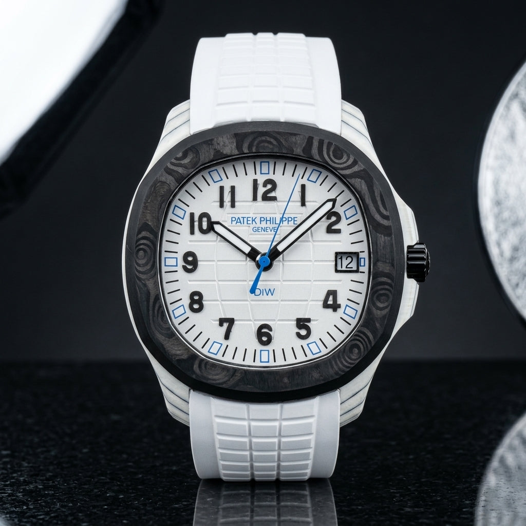 White carbon grid-dial watch with a black marbled bezel, black numerals and blue hour markers, upright on polished black granite