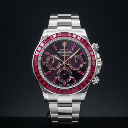 Aubergine dial steel chronograph worn under a navy suit cuff