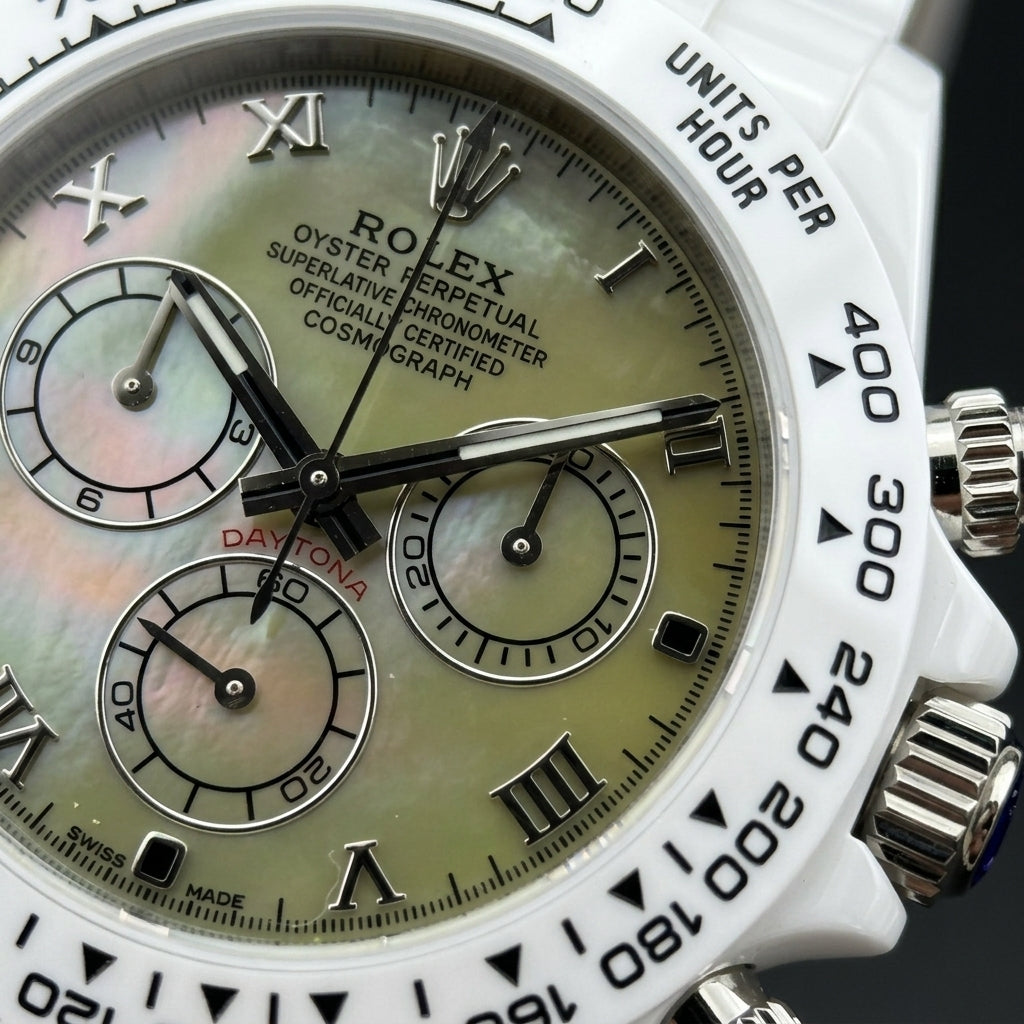 Macro of the iridescent green mother-of-pearl dial with steel Roman numerals and three steel-ringed counters