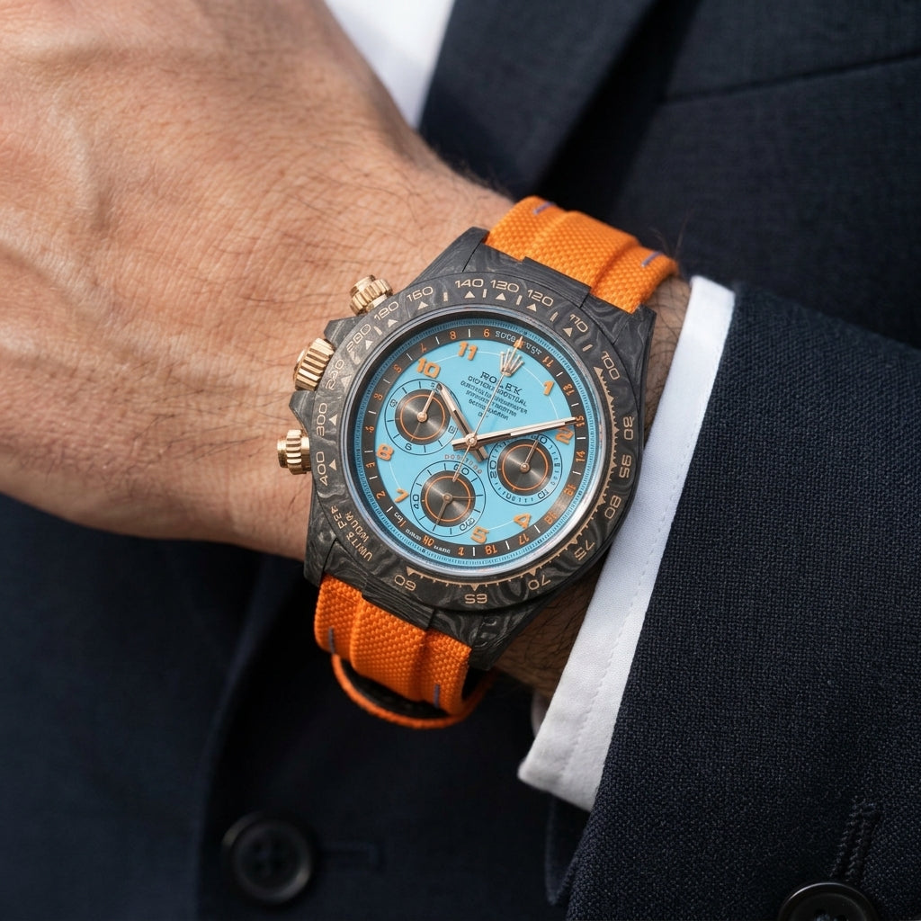 Forged-carbon chronograph with an ice-blue telemetre dial on the wrist as a shirt cuff is fastened