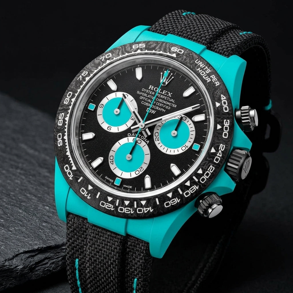 Turquoise-cased chronograph at a three-quarter angle on dark slate