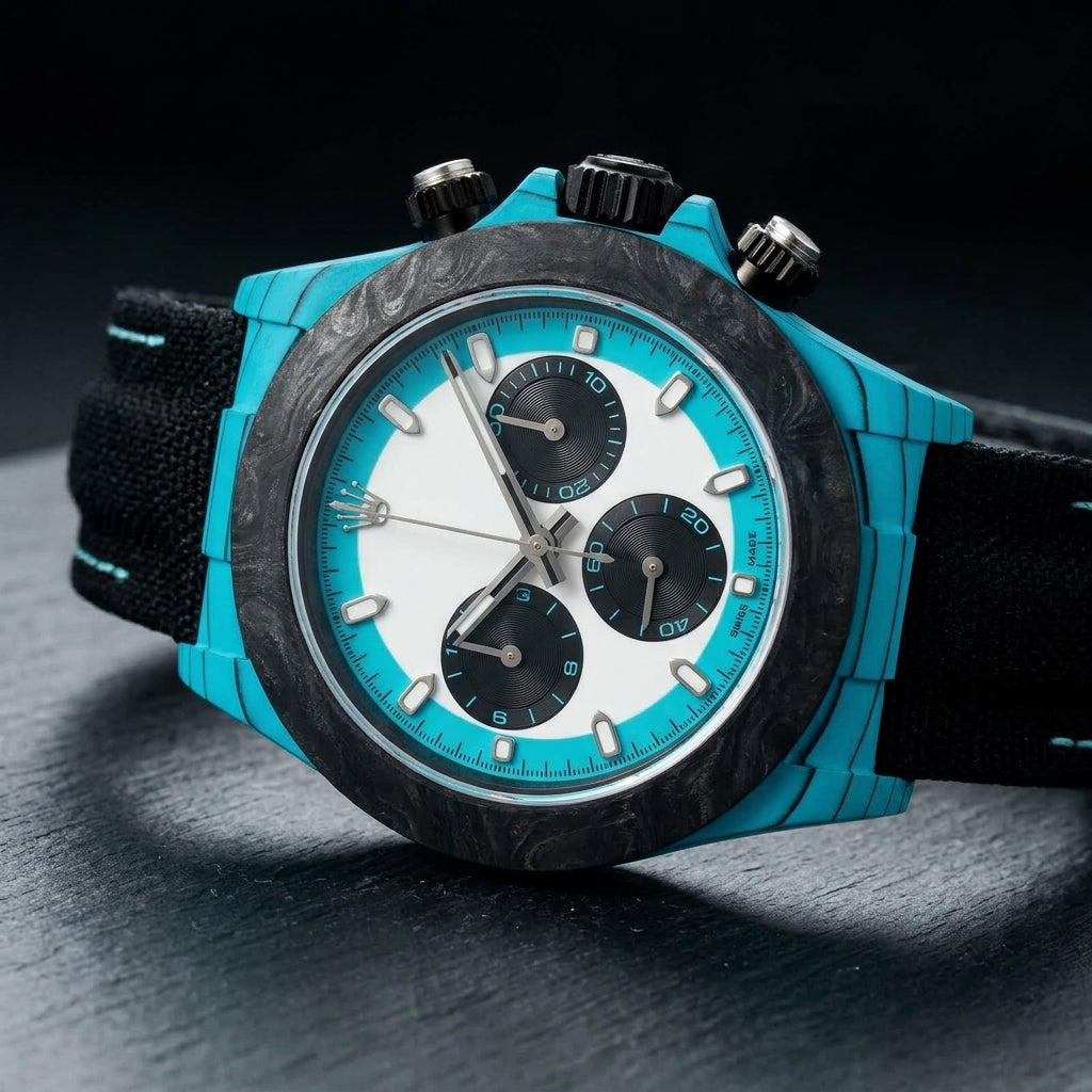Turquoise-cased chronograph at a three-quarter angle on dark slate