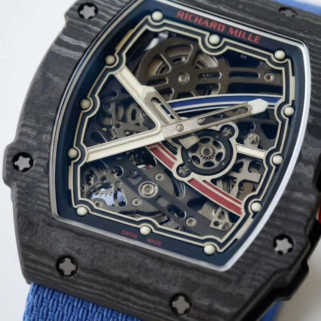 Macro of the open skeleton dial: brushed silver frame on navy, brushed silver X with a blue stripe toward two and a red stripe toward four