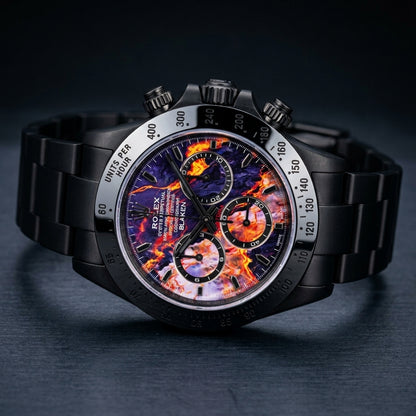 Violet lava chronograph at a three-quarter angle on dark slate, showing its mirror-polished black bezel and black screw-down pushers
