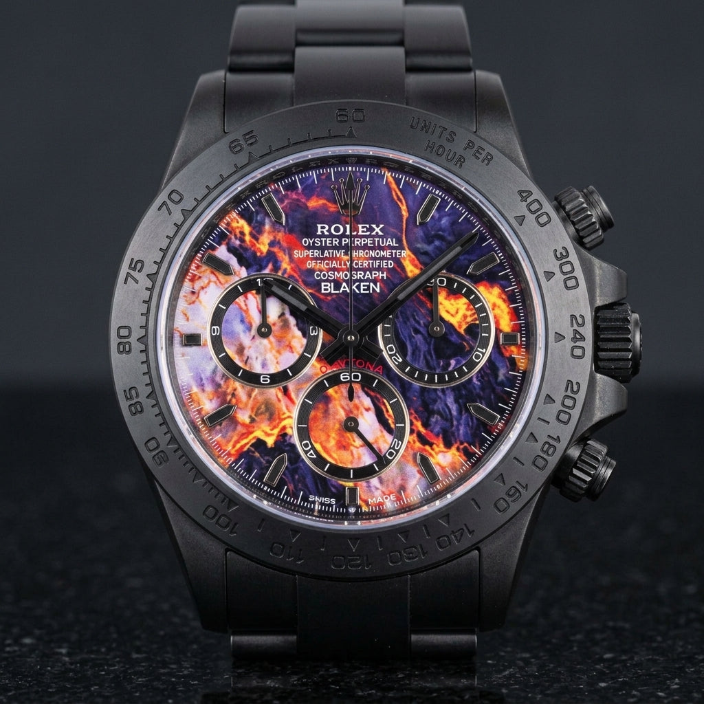 Black DLC chronograph with a violet lava dial on a black steel bracelet, worn on the wrist below a navy suit cuff