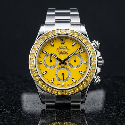 Steel chronograph with canary yellow dial and yellow stone bezel on black granite